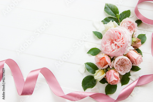 Pink roses on white   wooden board, space for text. Template for Wedding , 8 march, womens day, Mother's Day, Birthday Card. Pink flowers board, pink flowers layout, pink roses background