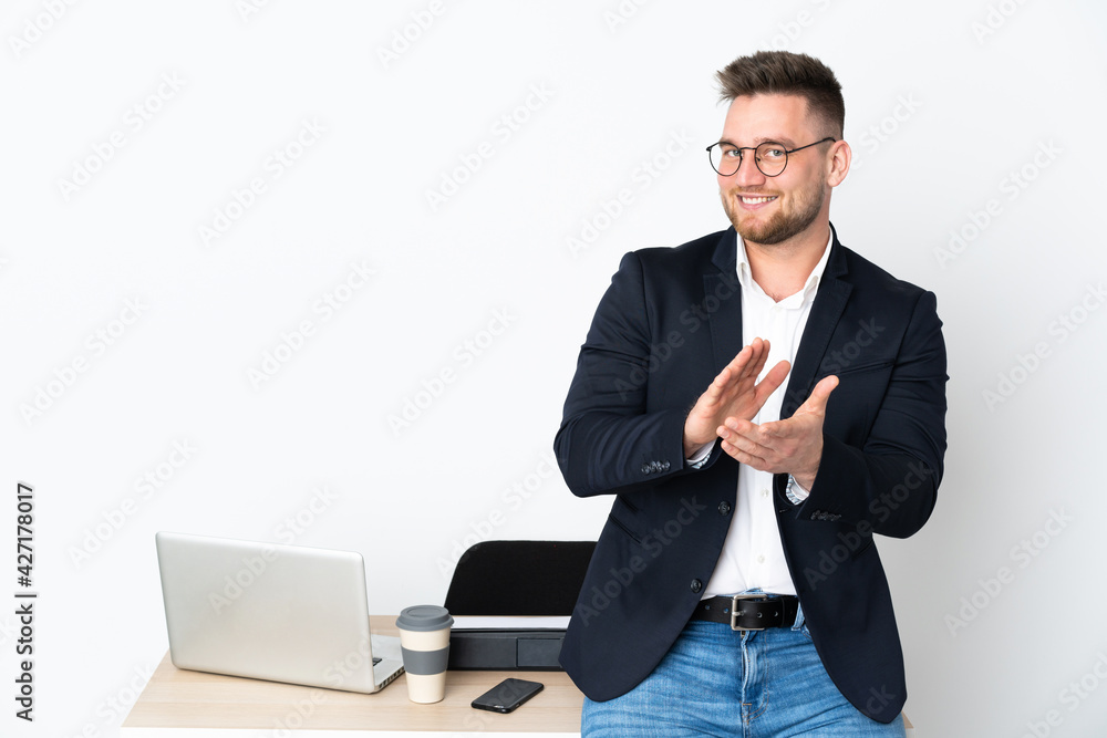 Russian man in a office isolated on white background applauding after presentation in a conference Russian man in a office isolated on white background applauding after presentation in a conference
