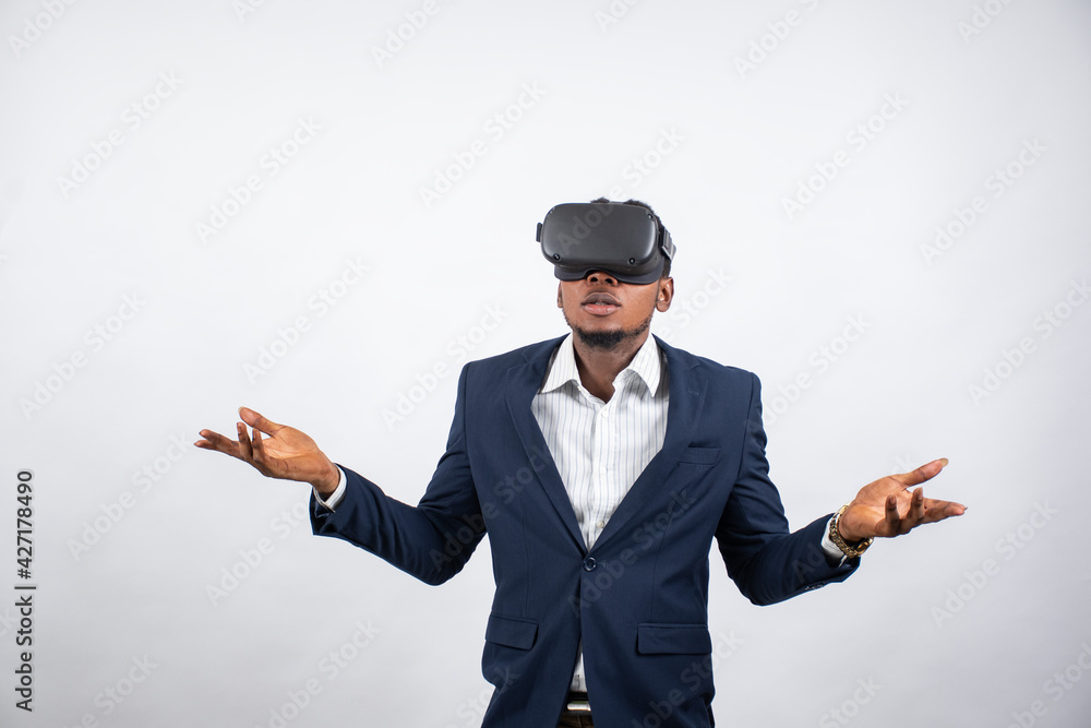 young nigerian business man using vr headset young nigerian business man using vr headset