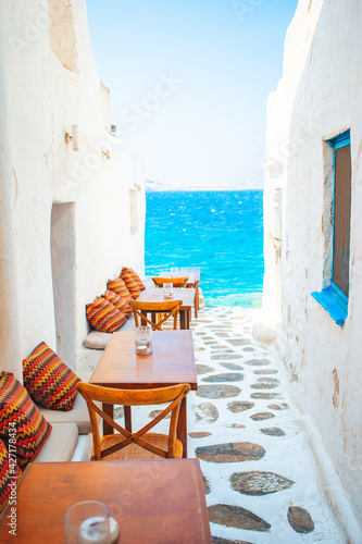 Typical Greek bar in Mykonos town with sea view, Cyclades islands, Greece