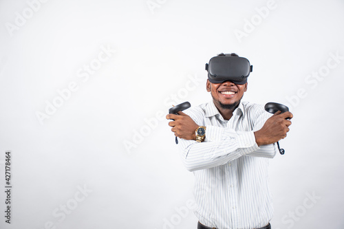 nigerian man using a virtual reality head set and controllers