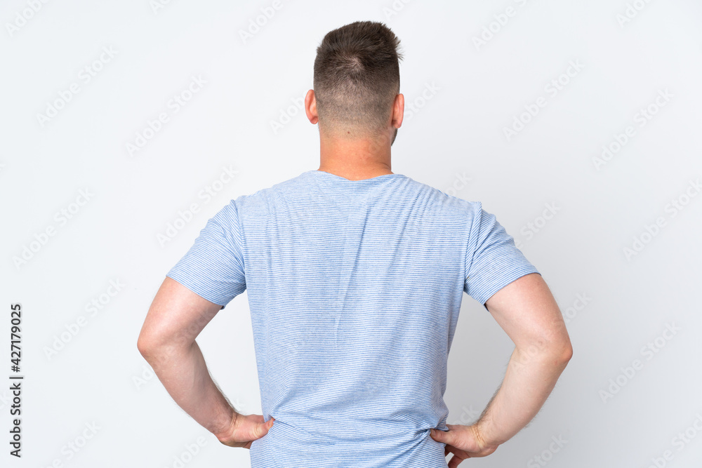 Russian handsome man over isolated background in back position Russian handsome man over isolated background in back position