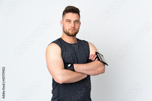 Russian sport man isolated on white background with arms crossed