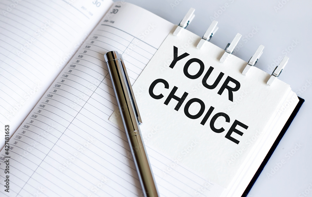 text YOUR CHOICE on the short note texture background with pen text YOUR CHOICE on the short note texture background with pen