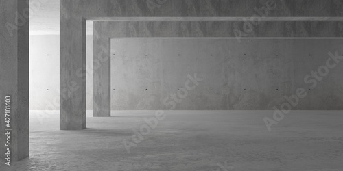 Abstract empty, modern concrete room with pillars and indirect light from the left wall and rough floor - industrial interior background template