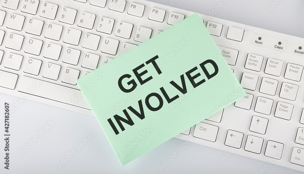 text GET INVOLVED on envelope on keyboard on the white background text GET INVOLVED on envelope on keyboard on the white background