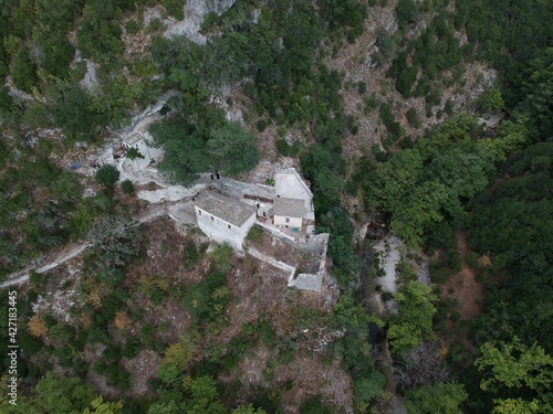 ioannina greece, ancient stone architecture monastery of panagia raidiotissa of vrosina village in zalogitiko gorge mountains built in byzantine period 1628  photo