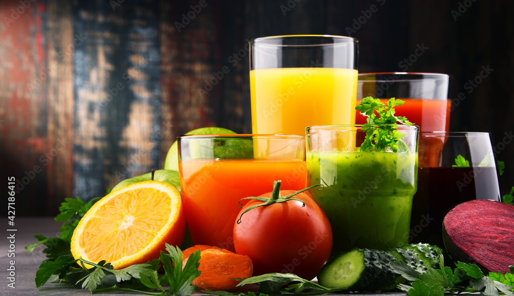 Glasses with fresh organic vegetable and fruit juices Glasses with fresh organic vegetable and fruit juices