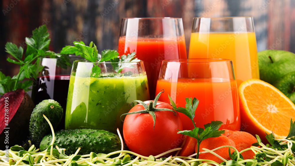 Glasses with fresh organic vegetable and fruit juices Glasses with fresh organic vegetable and fruit juices
