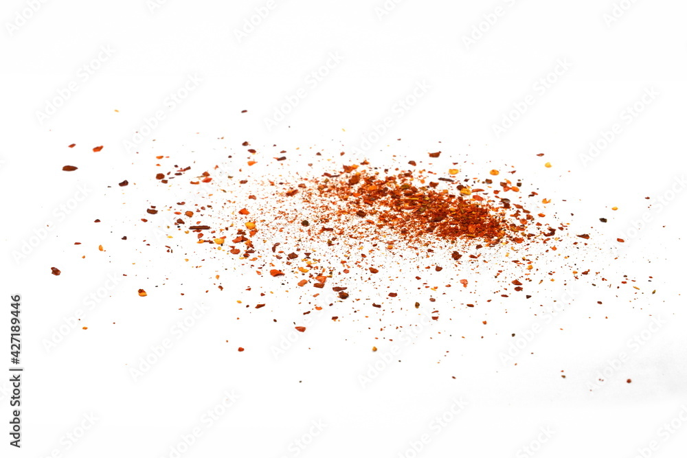 Red Hot Cayenne pepper isolated. Pile crushed red cayenne pepper, dried chili flakes and seeds isolated on white background Red Hot Cayenne pepper isolated. Pile crushed red cayenne pepper, dried chili flakes and seeds isolated on white background