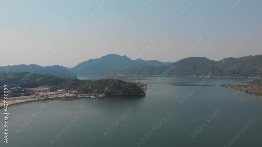 The huge river lake and forests trees. water is calm and mountains lay down back. The Beautiful nature drone aerial footage took with 4K 30fps. The huge river lake and forests trees. water is calm and mountains lay down back. The Beautiful nature drone aerial footage took with 4K 30fps.