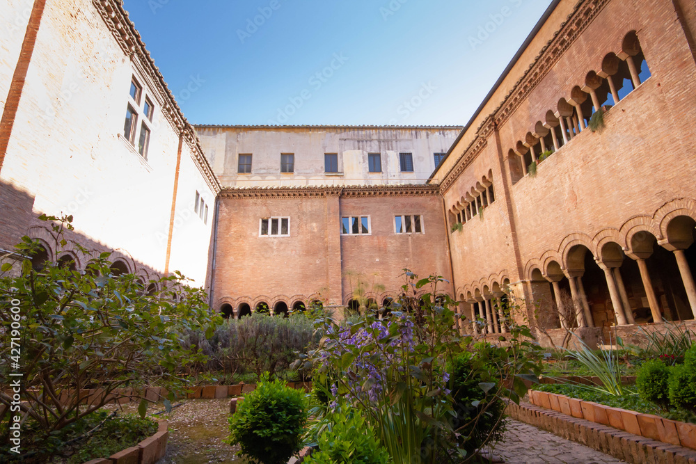 The Cloister of the Basilica of San Lorenzo,  with long corridor built in the 12th c.,has three and four light windows, that can be seen on the upper floor overlook the garden