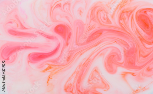 Abstract background pattern and texture of swirling pink ink