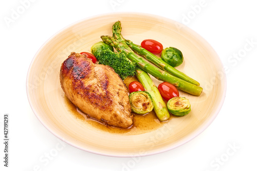 Grilled chicken breast with vegetables. Healthy food, isolated on white background. High resolution image