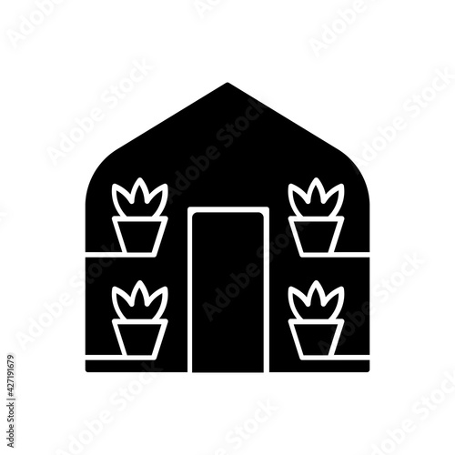 Greenhouses black glyph icon. Structure with walls and roof in which plants requiring regulated climatic conditions are grown. Silhouette symbol on white space. Vector isolated illustration