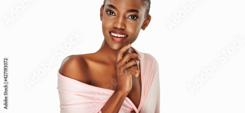 Beautiful black woman . Beauty portrait of african american woman with clean healthy skin on white background. Smiling beautiful afro girl.
