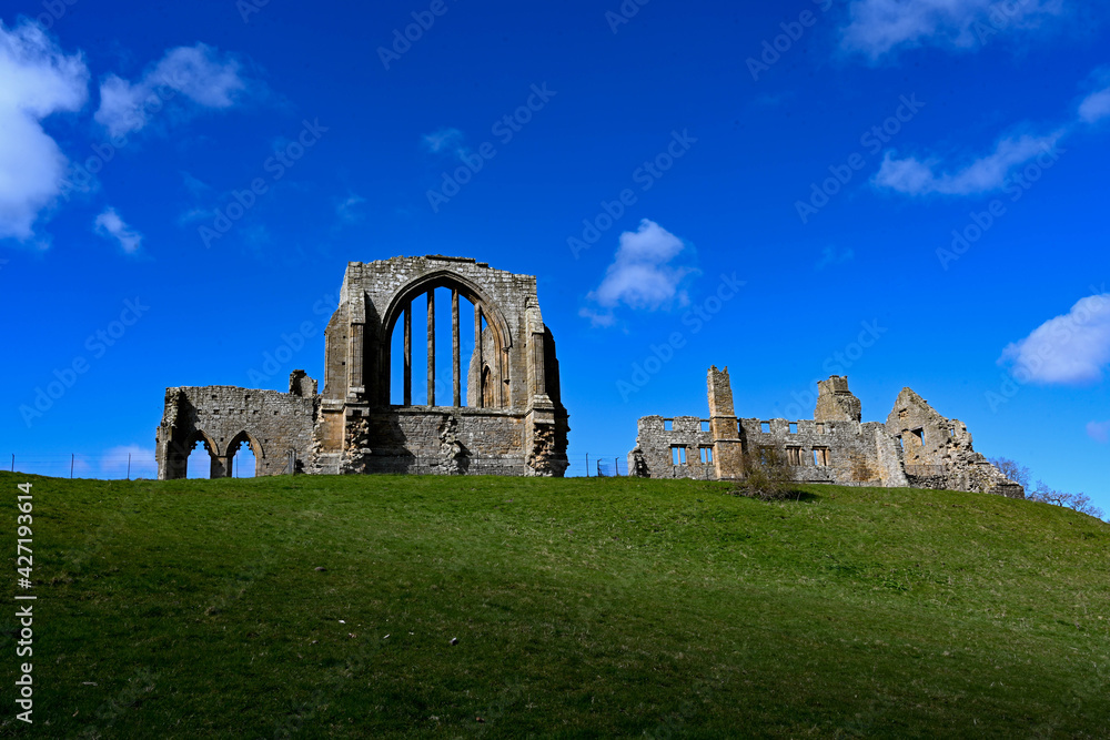 Egglestone Abbey against a cloudy blue sky