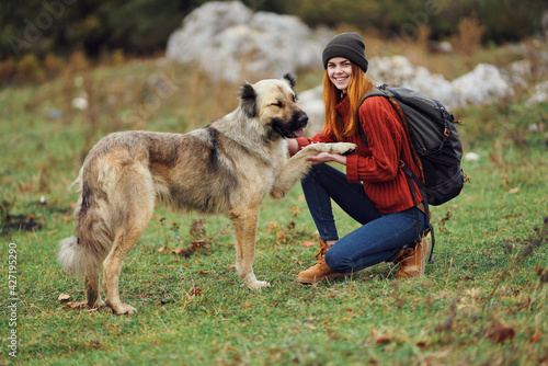 woman hiker backpack travel friendship walking the dog fun mountains © SHOTPRIME STUDIO