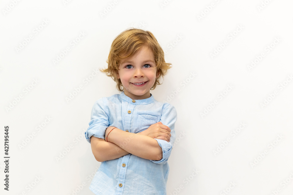 Portrait of a smiling boy. White background. Portrait of a smiling boy. White background.
