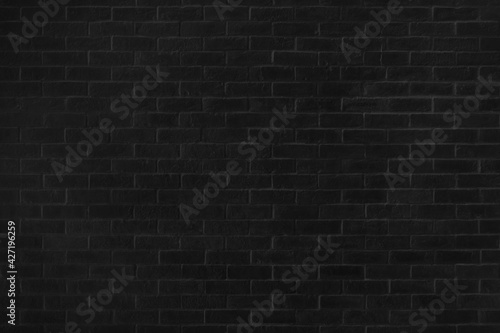 Black brick texture details background. House, shop, cafe and office design backdrop. Paint brickwork wall and copy space.
