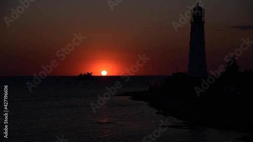 Wallpaper Mural Marine timelapse silhouette of the coast and sea lighthouse with the movement of clouds in the evening 4k Torontodigital.ca