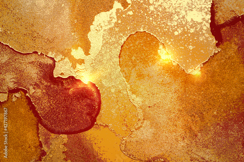 Amber, red and gold abstract background. Alcohol ink marble texture with glitter. Template pattern for banner, poster design. Fluid art painting