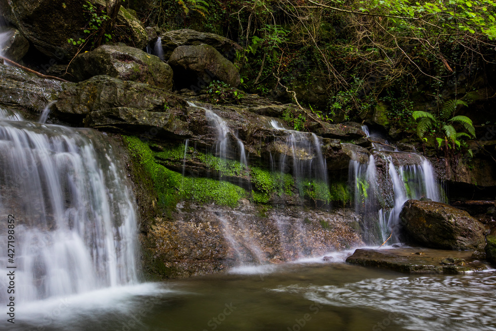 Fototapeta premium Spring waterfall in La Garrotxa, Girona, Spain