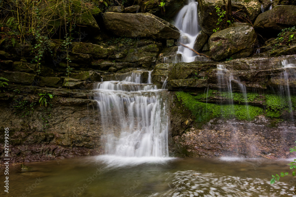 Fototapeta premium Spring waterfall in La Garrotxa, Girona, Spain
