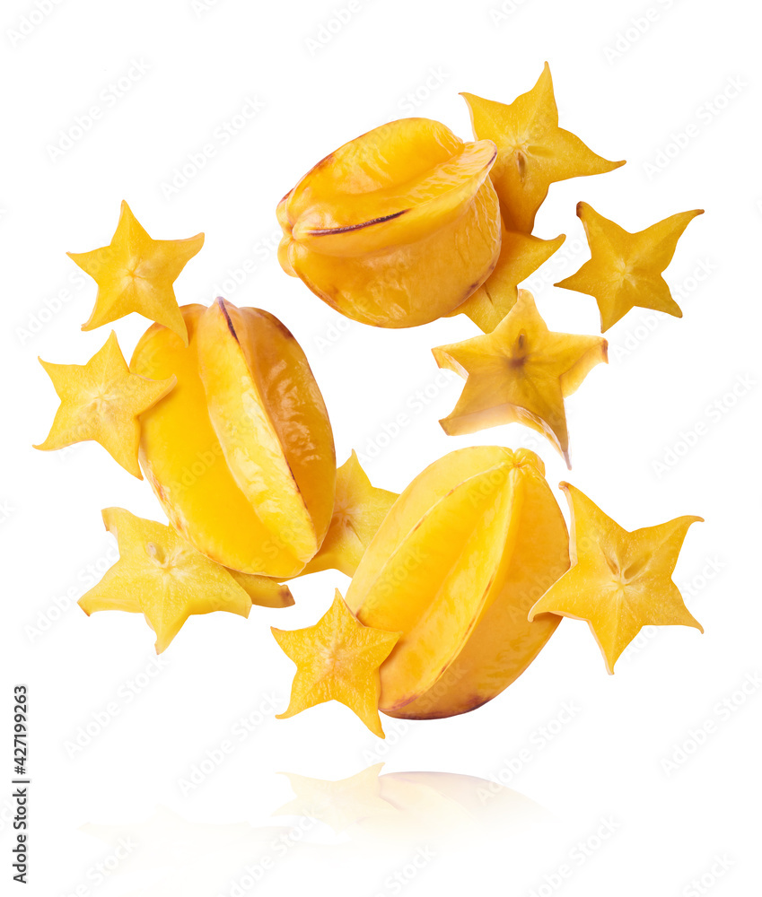 Fototapeta premium Creative image with fresh yellow carambola falling in the air
