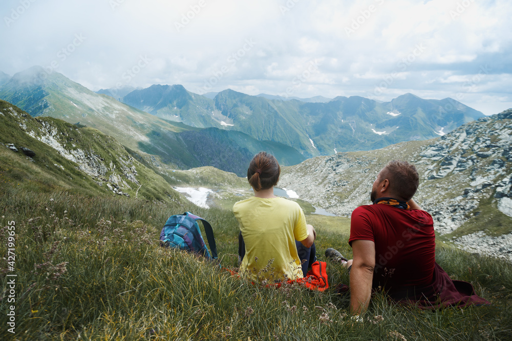 Fototapeta premium girl with dad on a trail in the mountains
