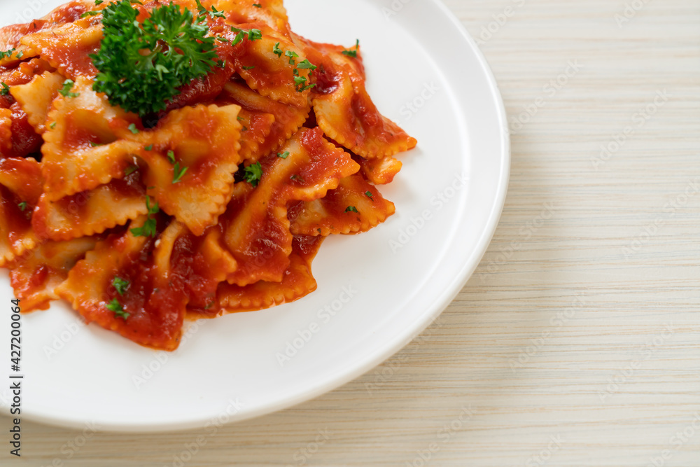 farfalle pasta in tomato sauce with parsley farfalle pasta in tomato sauce with parsley