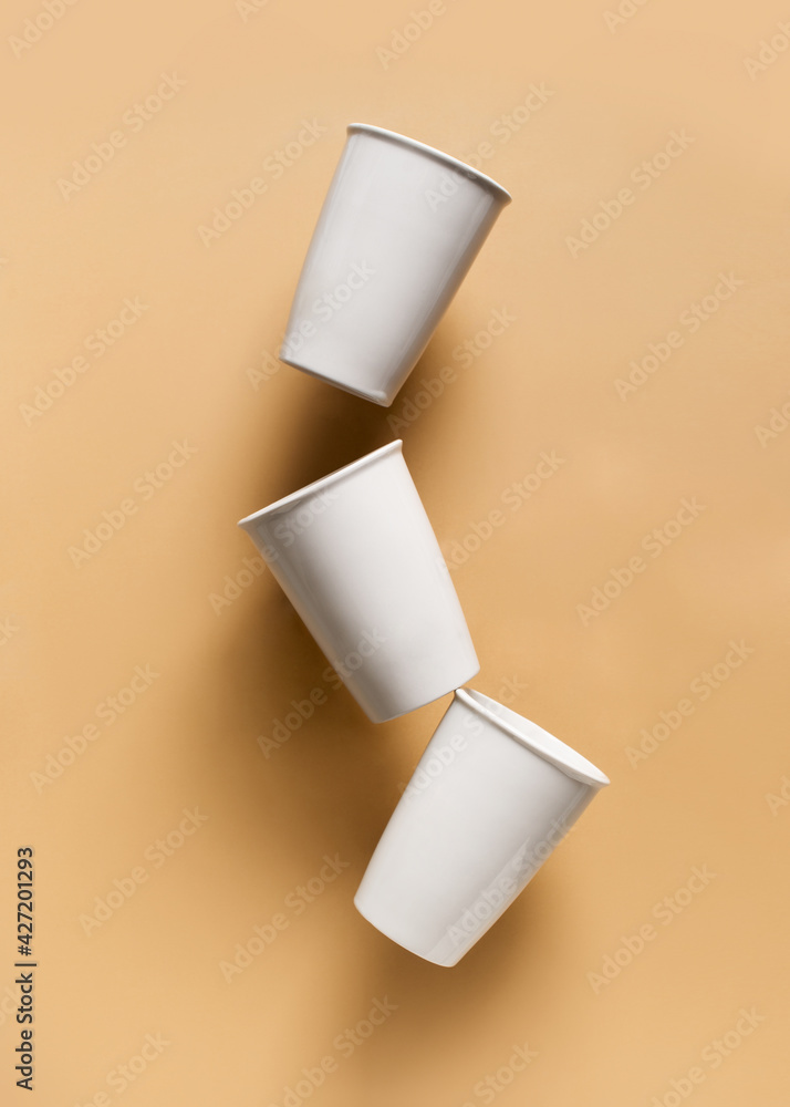 Mug or cup of coffe to go porcelain on brown background Mug or cup of coffe to go porcelain on brown background