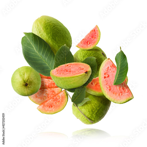 Foto Fresh ripe guava falling in the air. Zero gravity concept