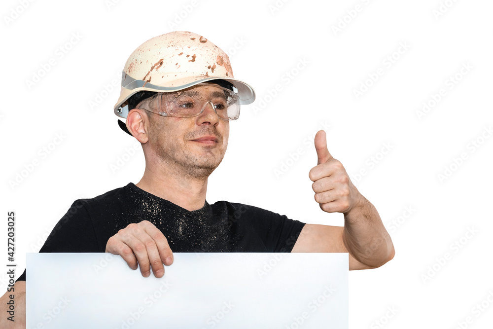 A man in a construction helmet shows a thumb up. All OK. Mock-up. White isolated background. A man in a construction helmet shows a thumb up. All OK. Mock-up. White isolated background.