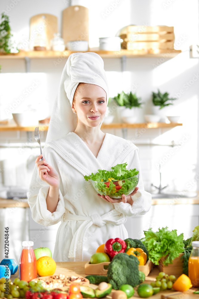 Happy Excited Woman In Bathrobe Eat Healthy Food - Vegetable Salad Happy Excited Woman In Bathrobe Eat Healthy Food - Vegetable Salad
