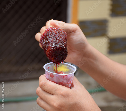 Indian Chuski or Kala Khatta (popsicle) or gola close up shot. Indian Icecream