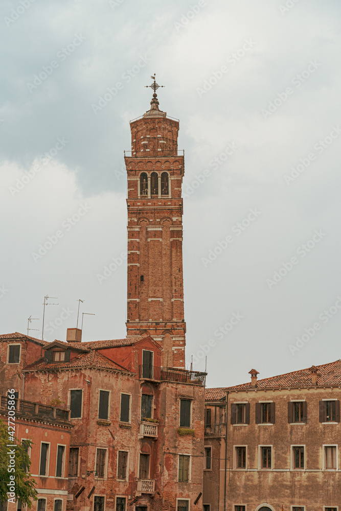 Bending Venetian tower in rain.