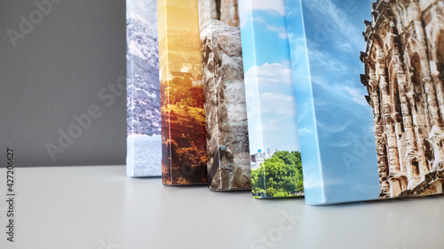 Cuadro en lienzo Canvas prints stacked on white surface. Photo printed on canvas