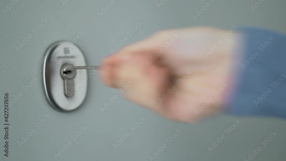 The Girl Opens the Door to the House with a Key and Enters the ...
