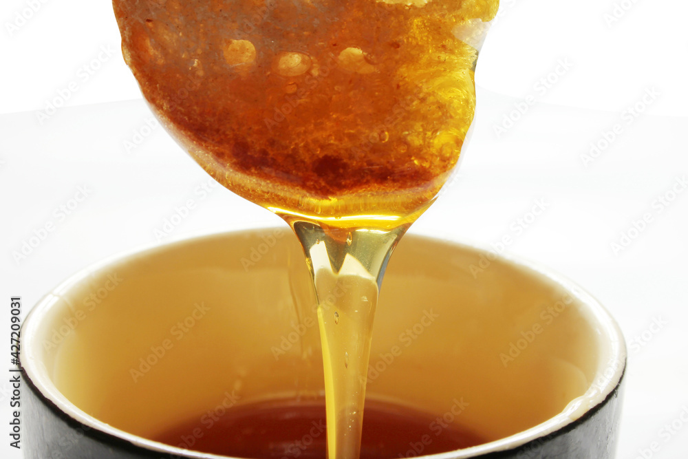 Honey and slice of bread. Honey and slice of bread.