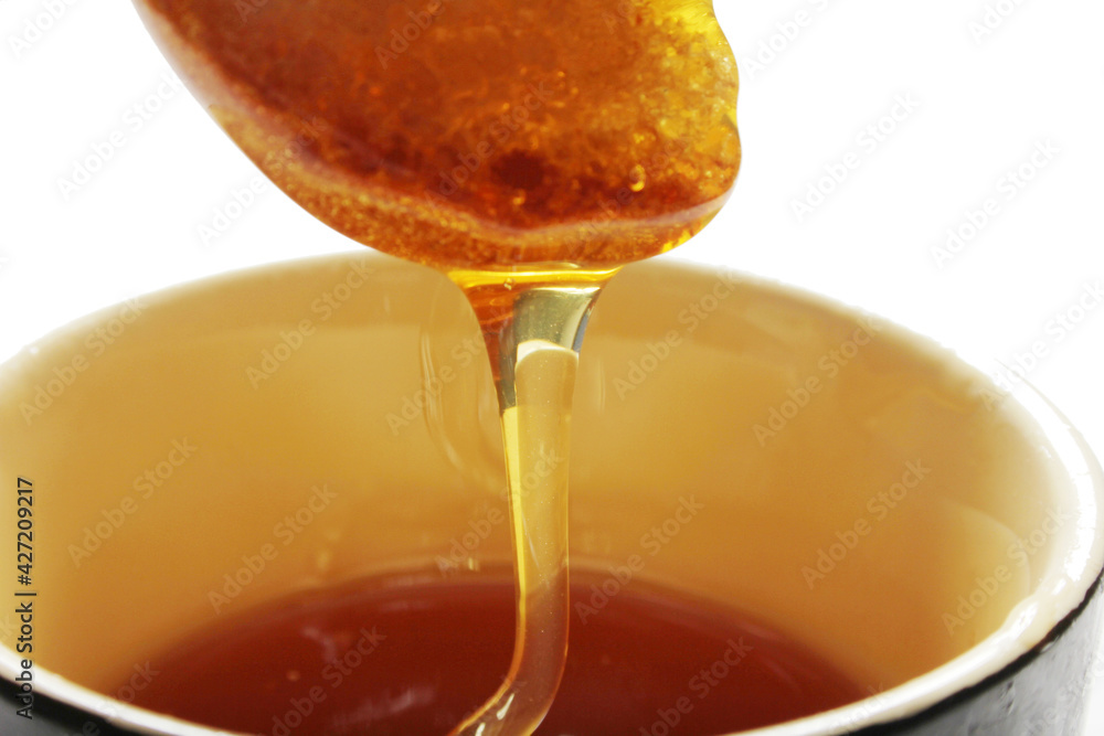 Honey and slice of bread. Honey and slice of bread.