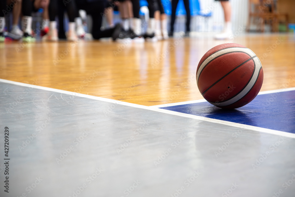 Naklejka premium Basketball ball on the floor
