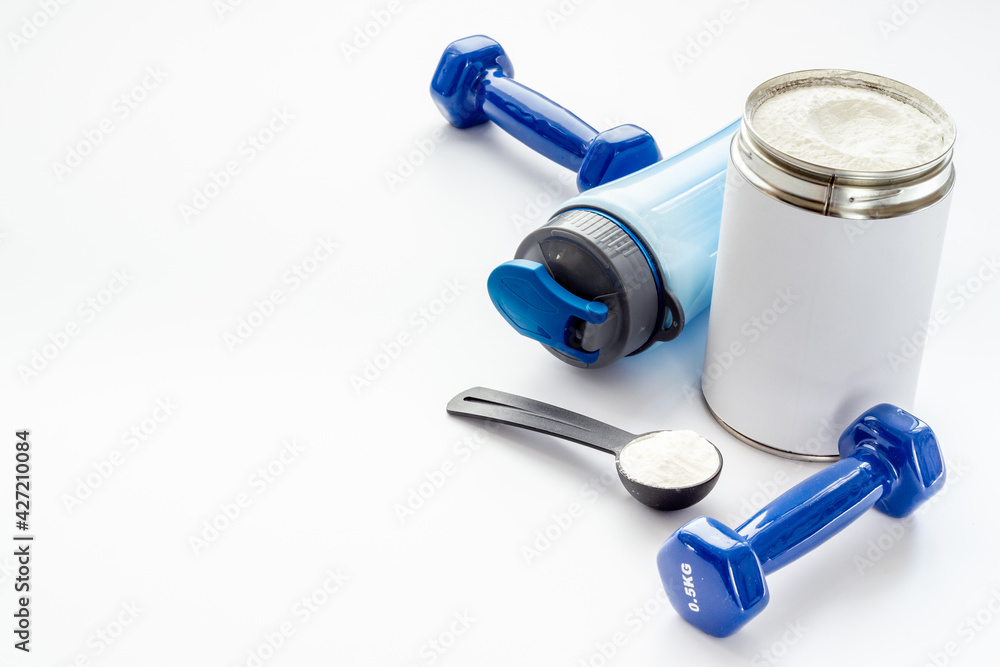 Whey prorein in shaker with dumbbells. Sport diet nutrition Whey prorein in shaker with dumbbells. Sport diet nutrition