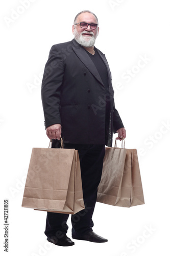 senior business man with shopping bags . isolated on a white background.