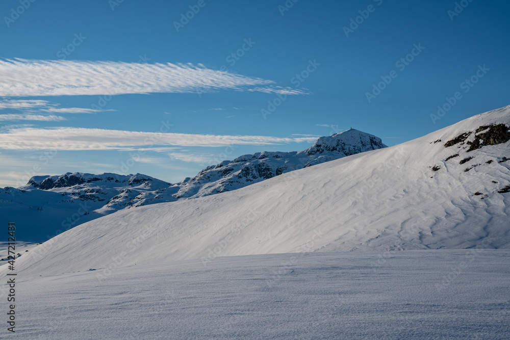 Mountain wilderness winter landscape on a bright sunny day.