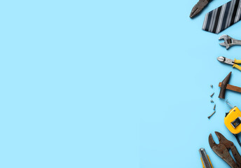 Top view design concept of Father's day with working tools on blue background.