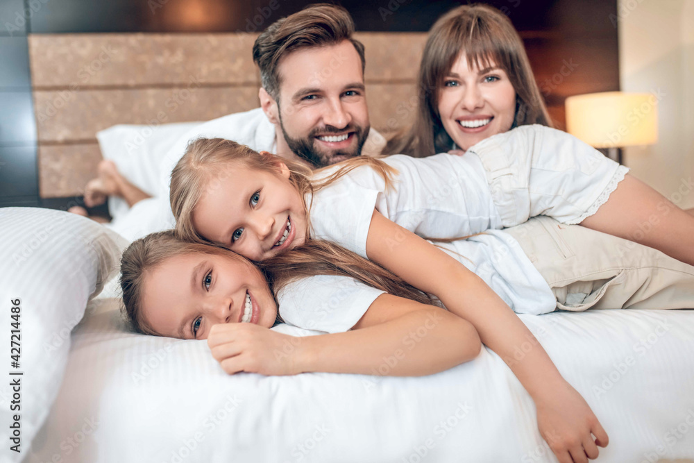 Two kids looking happy having vacation with parents Two kids looking happy having vacation with parents