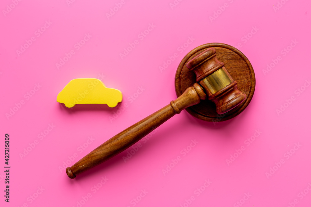 Car shape with judge gavel. Driving and insurance law concept Car shape with judge gavel. Driving and insurance law concept