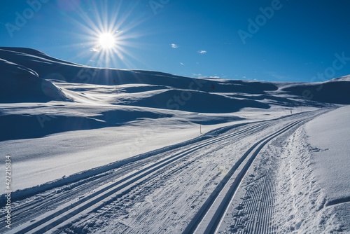 Cross country skiing tracks in a Nordic mountain terrain on a cold sunny winters day.