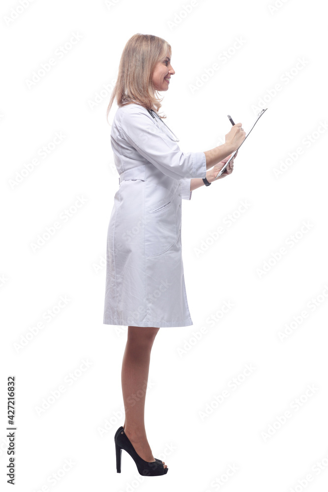 smiling doctor making notes in the clipboard . isolated on a white background. smiling doctor making notes in the clipboard . isolated on a white background.